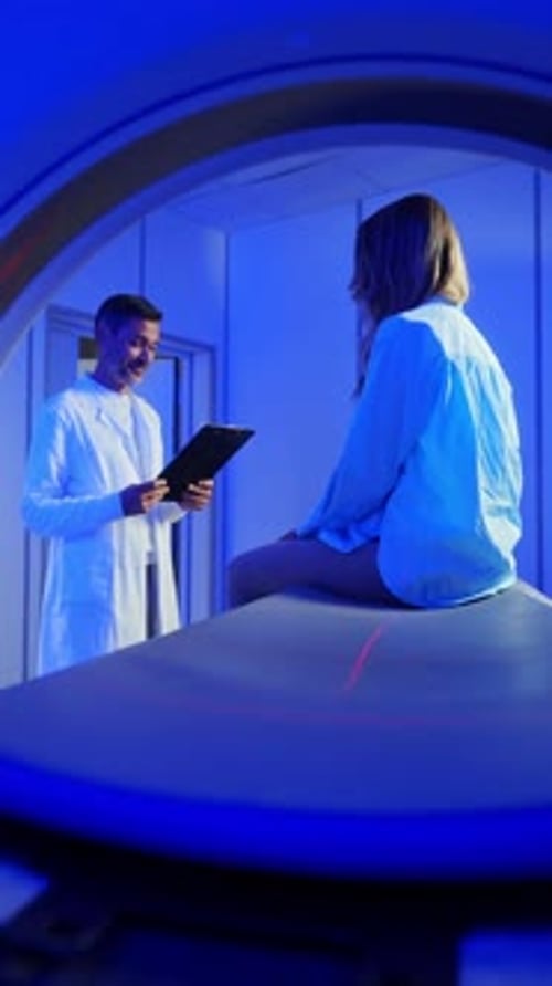 Medical Worker Explaining CT Scan Results to Patient in Hospital Setting MRI Machine and