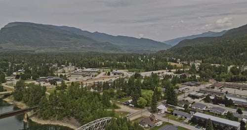 Revelstoke BC Canada Aerial v2 drone flyover Columbia river capturing picturesque townscape, bridges