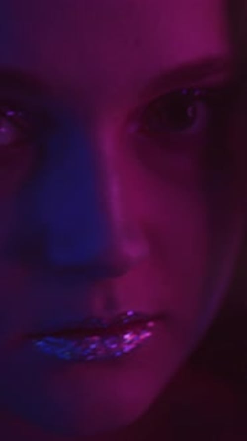 Vertical Video Neon Face Sparkling Makeup Girl