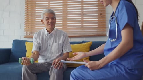 Senior Man Lifts Weights During a Home Healthcare Visit