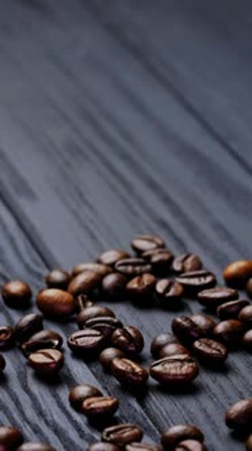 Coffee Beans and Sack on Dark Wooden Surface