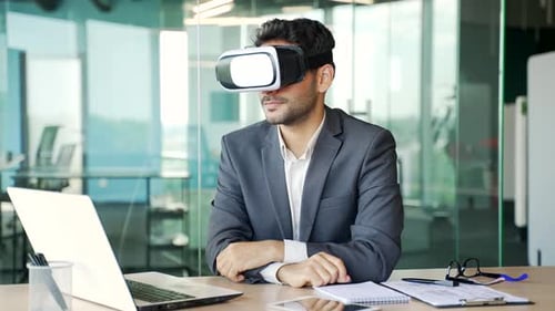 Man Wearing VR Headset in Modern Office