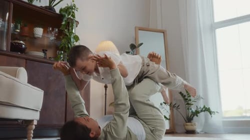 Mother and Child Playing Together at Home