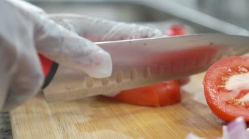 Tomato Sliced on Cutting Board for Preparation