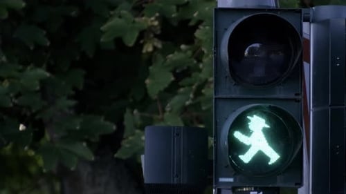 Green Traffic Light with Man in Hat Symbol Enhances Safety on Roads