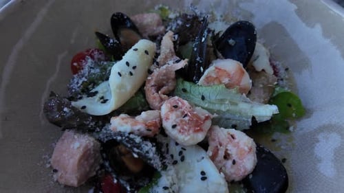 Close Up View of a Delicious Seafood Salad With Black Sesame Seeds