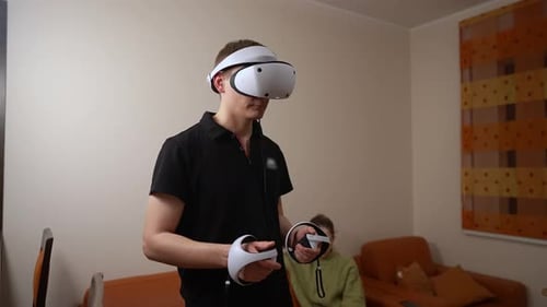 Young Adult Man Using a VR Headset Indoors