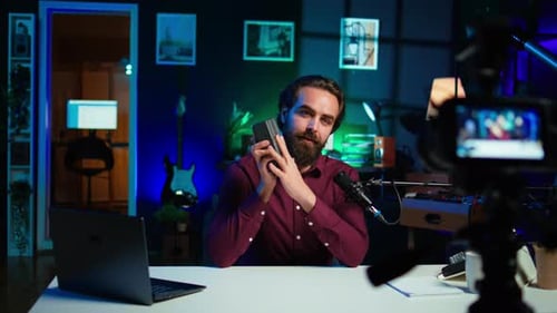 Lithium Li Ion Charging Device Held By Content Creator Doing Presentation