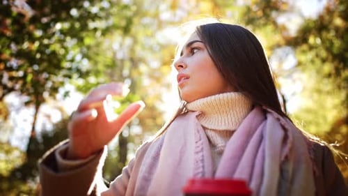 Portrait Caucasian Charming Lovely Dreamy Lady Hand Hold Glass Coffee and Enjoy Drink in Autumn Park