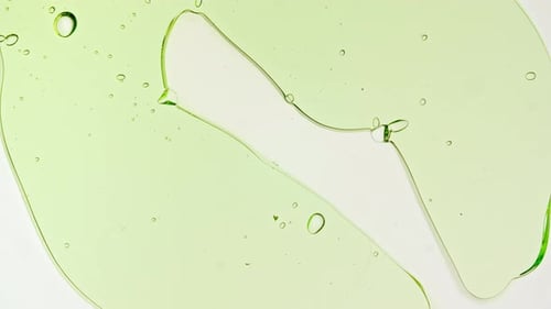 Light Green Liquid Spreads on White