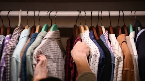 Shirts Neatly Organized in a Closet