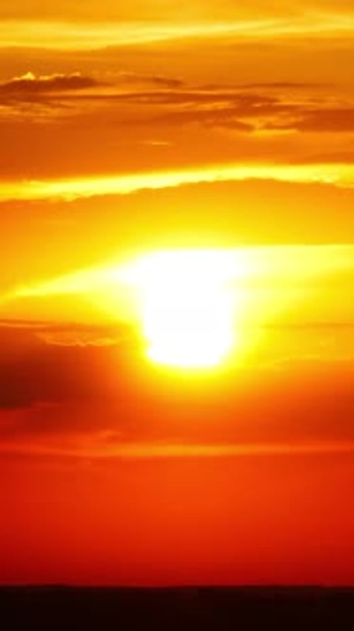 Dramatic Red Sunrise on Dark Cloudy Sky