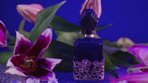 Close-up zoom in to a vintage blue fragrance bottle