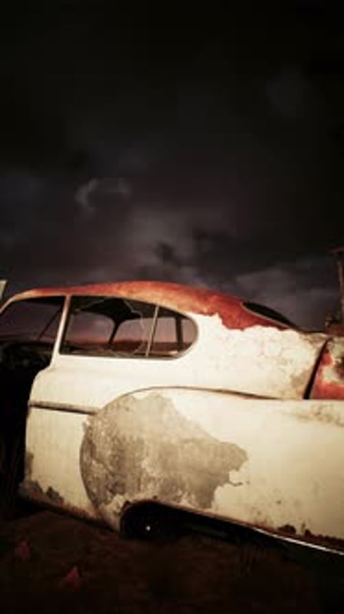 Abandoned Vintage Car in Field