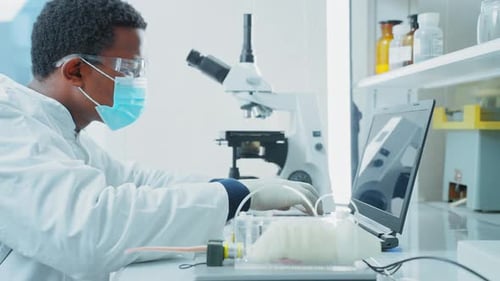 Focused Scientist Working in Modern Laboratory