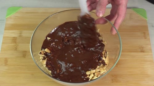 Mixing Chocolate and Biscuits in Glass Bowl