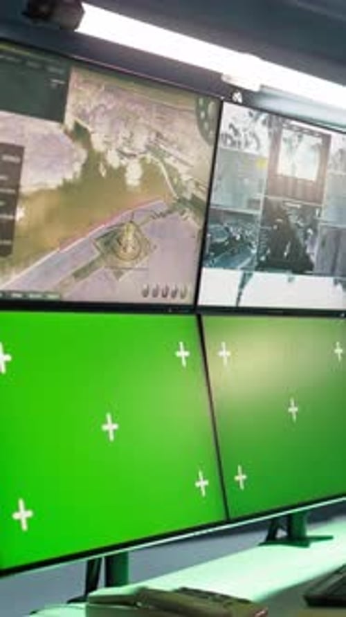 Monitors Displaying Data and Green Screens