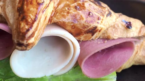 Sandwich With Smoked Chicken Salami on Table
