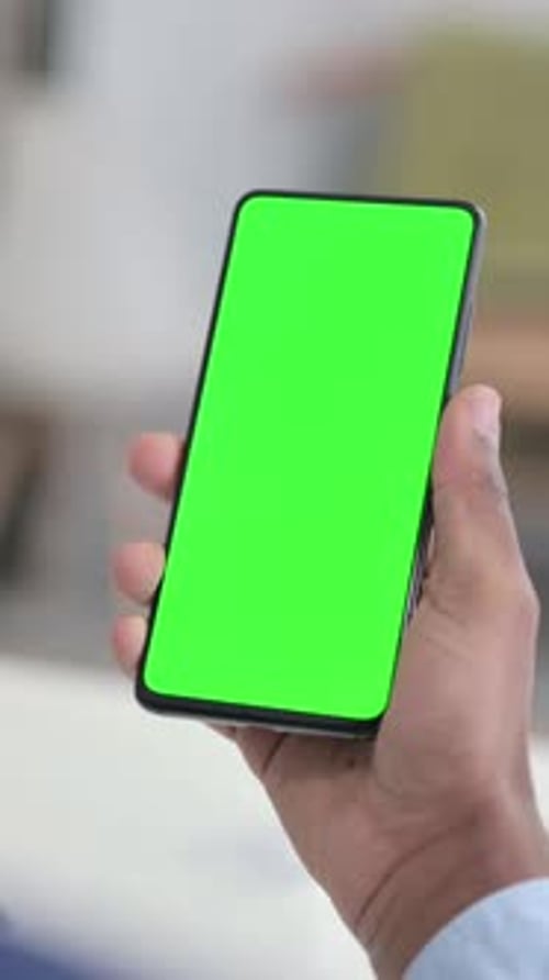 Businessman using Smartphone with Green Chroma Key Screen, Vertical Video