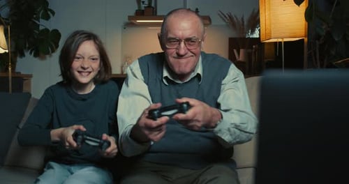 Child and Adult Playing Video Games at Home