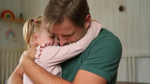 Loving Father and Daughter Sharing Affectionate Embrace