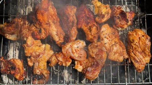 Grilled Chicken Sizzling on Barbecue Grill