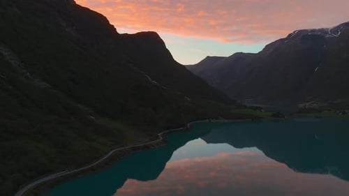 Oldevatnet lake at Briksdalsbreen Glacier in Norway, Scandinavia. Epic mountain sunset nature aerial