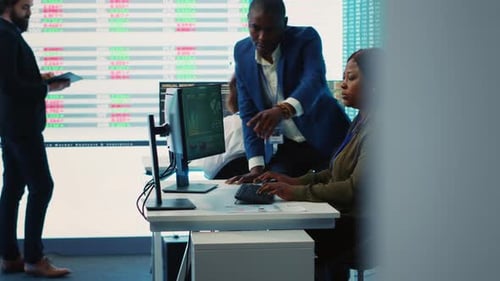 Business Associates Evaluating Key Performance Indicators Within the Company