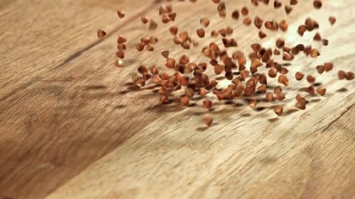 Buckwheat Falls on a Wooden Table Filmed on a Highspeed Camera at 1000 Fps