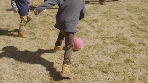 Family Playing Football in Backyard Activity