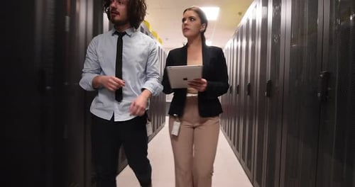 Team of Business People Data Analysts Specialist Coworking in Data Center Monitoring Supercomputer