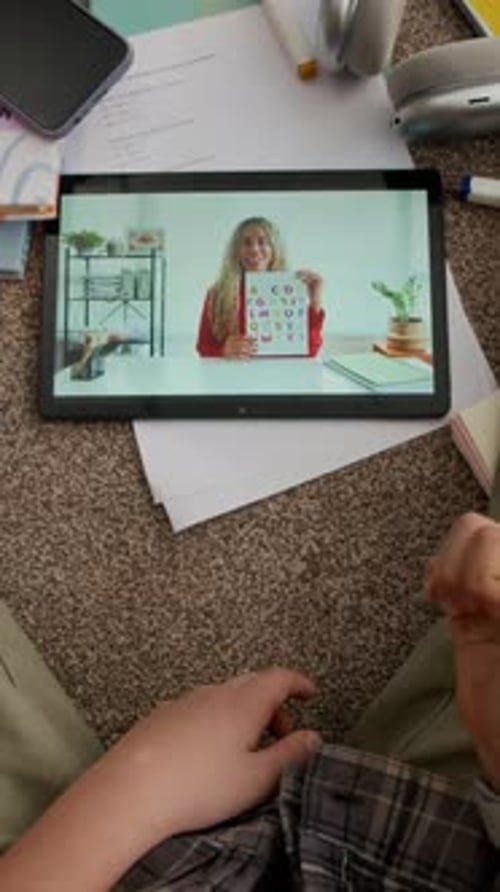 Student learns alphabet remotely using a tablet