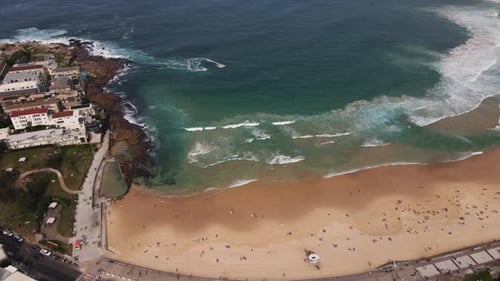Pan Drone shot of Bondi beach and out to sea. Ocean and sea stock videos.