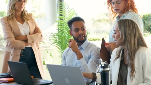 Diverse Team Collaborating in Modern Office Setting