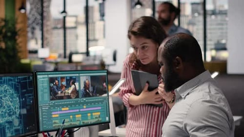 Creative Team Editing Film Footage with Artificial Intelligence Software