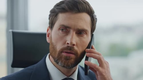 Business Man Calling Partners Using Smartphone at Office Close Up