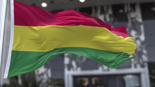 Realistic Red Yellow Green Flag Waving Loop with Blurred Background