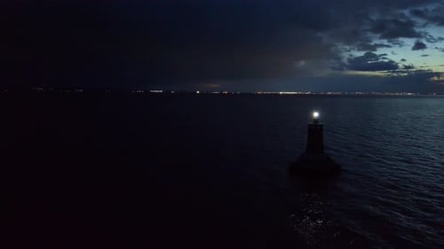 Aerial View of the Lighthouse in the Black Sea Under the Night Sky Near the Town of Pomorie in