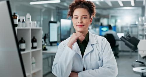 Woman Smiling While Working in Science Laboratory