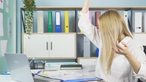 Frustrated Woman Working at Computer in Office
