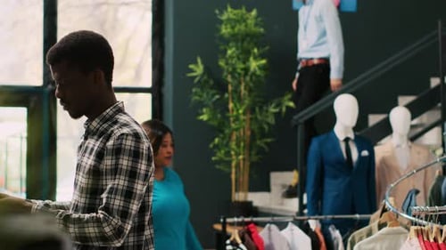 Man Smiling at Clothing Store
