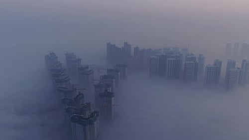 A city that seems to be floating in the air with fog and dust.