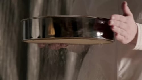 Baker Hands Pouring Sifts Flour Through a Sieve Close Up Prepares the Dough for Bread Slow Motion