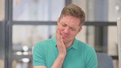 Portrait of Mature Adult Man with Tooth Pain