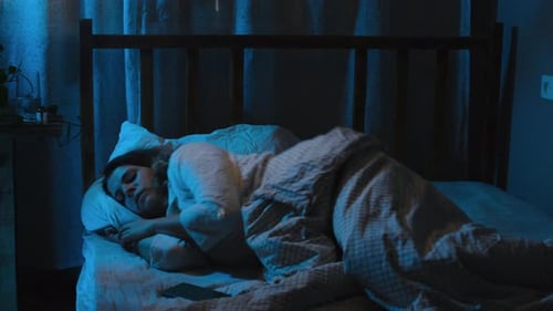 Insomnia Restless Sleep at Night Young Woman Tossing and Turning Lying in Bed