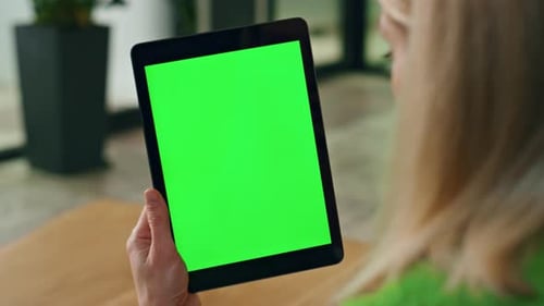 Woman Holding Tablet With Green Screen Display