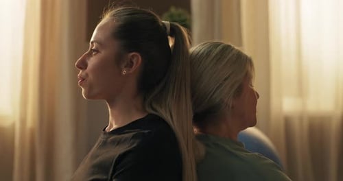 Women Meditating Together in Peaceful Home Setting