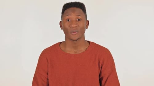 Young Adult Speaking Against White Background