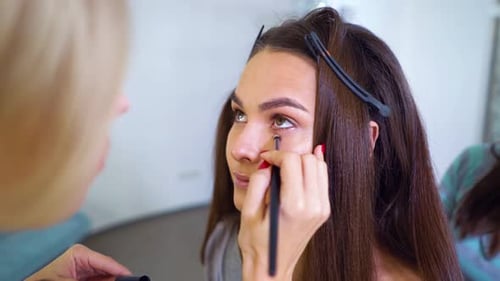 Applying Makeup to Model in Beauty Studio