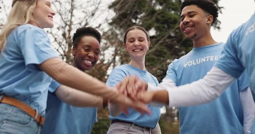 Hands together, volunteer and people in park for teamwork at charity event